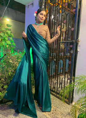 Shimmery nude coloured blouse Satin sari.